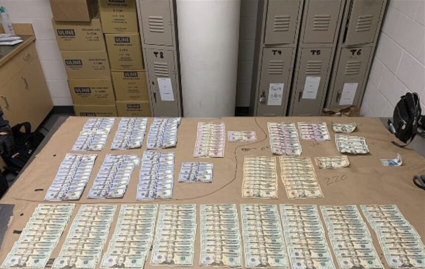 $70,977.13 in cash found with the suspects.