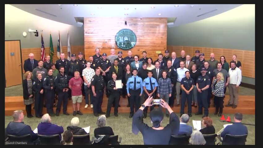 Olympia City staff from various service sectors pose for a photo opportunity with the city council after being recognized during the Public Service Recognition Week proclamation on Tuesday, May 7, 2024.