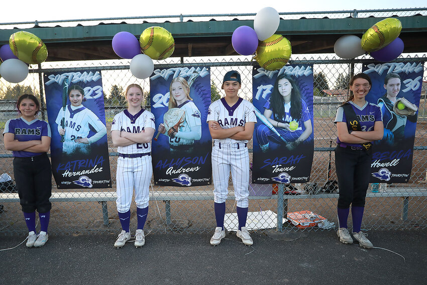 Four of the five seniors by their banners. (l-r) Katrina Hernandez, Ally Andrews, Sarah Towne, and Rebecca Howell.