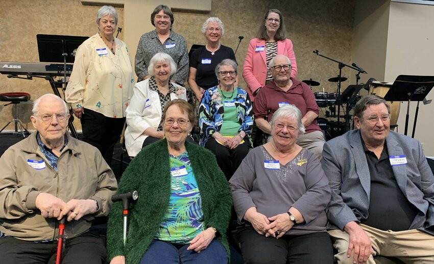 Past OGS president assembled to celebrate the 50th  anniversary of the Olympia Genealogical Society (OGS). Front: Norman Dodge, Eileen Dodge, Jerri McCoy, Steven Morrison. Mid: Alma Greenwood, Ann Olson, Roger Newman. Back: Pat Harper, Nancy Cordell, Kathy Erlandson, Kerri McHugh Upton.  May 18, 2024.