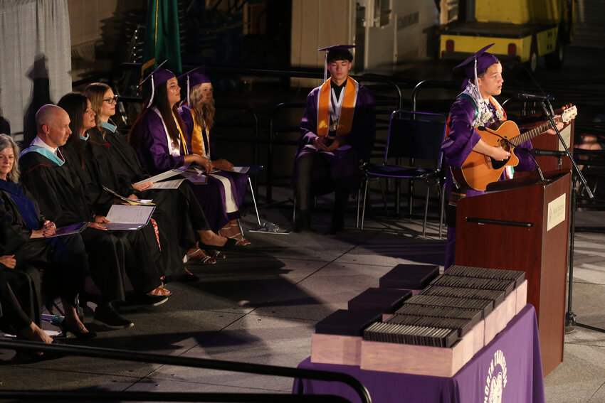 NTHS graduating senior Micah Mazzuca performs a piece on the guitar during Graduation.