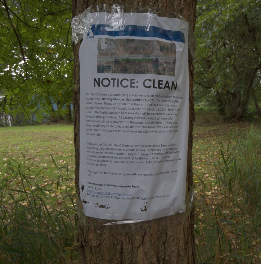 Residents living in The Jungle encampment were notified in advance of the removal of trash and abandoned vehicles.