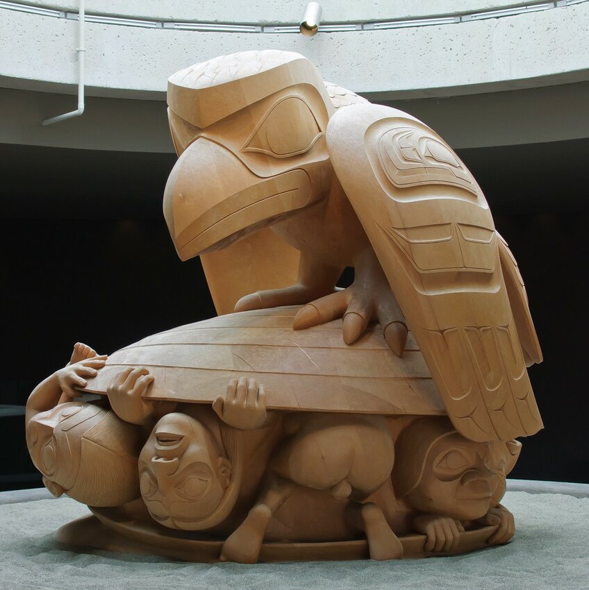 This original wooden sculpture, by Bill Reid, was done in 1980, depicting the Haida culture's legend where a raven discovers the first humans inside a clamshell, on Queen Charlotte Island off the northwest coast of British Columbia.