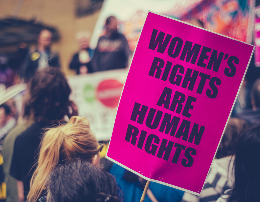 A sign at a rally that says "women's rights are human rights"