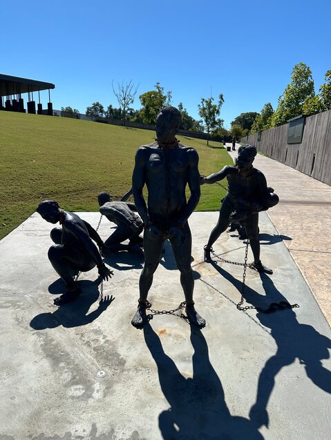 At the Equal Justice Initiative Legacy Sites lynching exhibit: statues representing slaves in chains.
