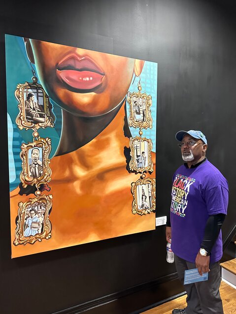 Jarvis enjoying a large mural at the New Orleans African American Museum.