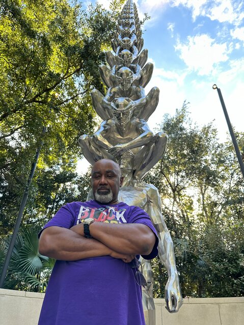 Jarvis is imitating a sculpture in the Sydney and Walda Besthoff Sculpture Garden at the New Orleans Museum of Art.
