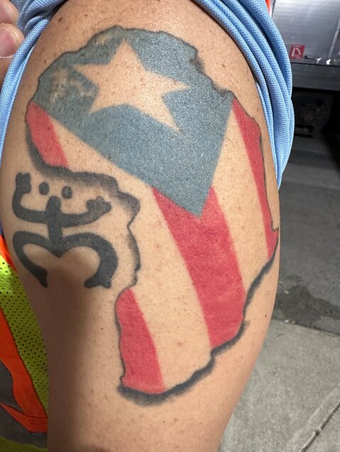 An Amtrak staff member showed Jarvis and Joe his Puerto Rican heritage tattoo.