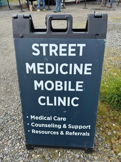 A Street Medicine Mobile Clinic sign.