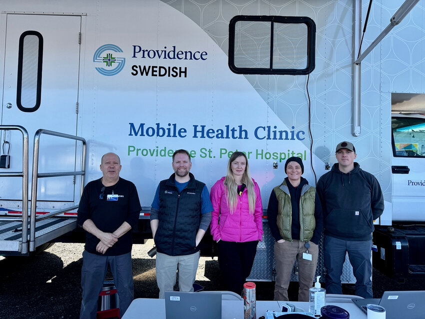 The Mobile Health Clinic team, as seen in front of medical van.