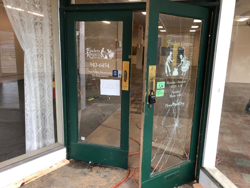The old Finders Keepers storefront, one of the businesses to have the front windows smashed by vandals this week, stands empty with still-cracked windows Wednesday morning.
