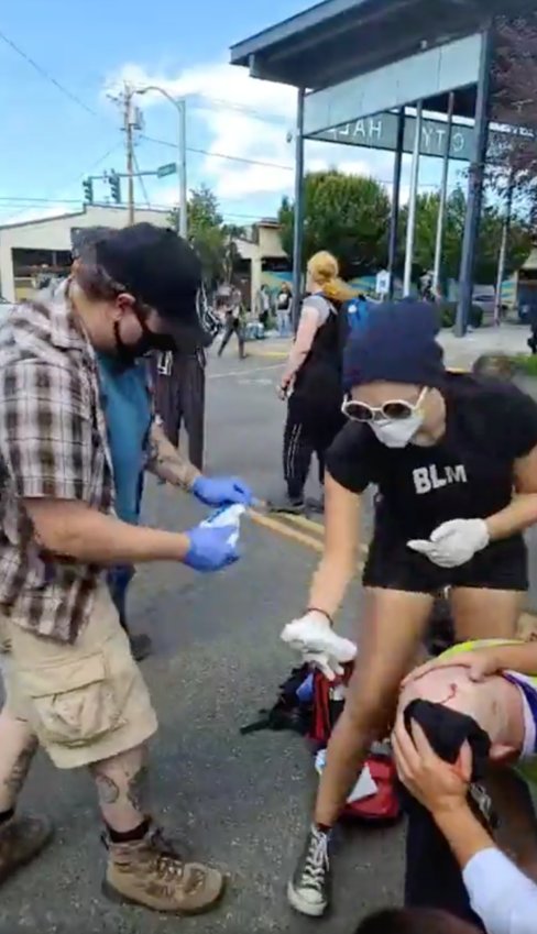 A man was attacked during a protest outside Olympia City Hall on Sunday.