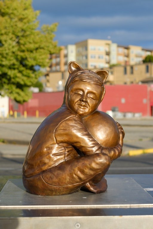 Child with Egg by Joe Batt, a sculpture that is up for the 2020 People's Choice contest, is one of several members of the community can vote on to be displayed at Percival Landing.