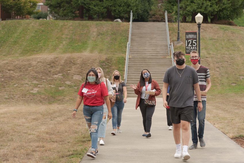 A group of St. Martin's University students roam the campus during the fall semester's move-in week.