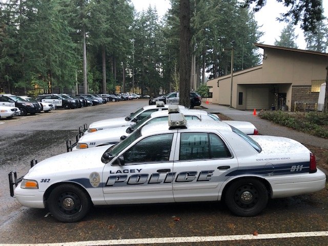 Lacey Police Department cars at rest next to Lacey Police Headquarters.