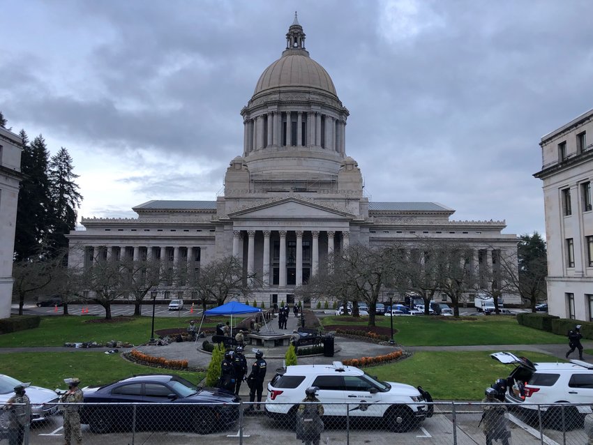 Washington National Guard soldiers and Washington State Patrol sheriff's deputies surrounded the Legislative Building on the Capitol Campus in Olympia, on Saturday, Jan. 9, 2021 following threats and riots in Olympia.