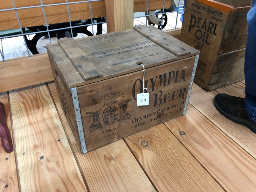 Olympia Beer case is unrestored and part of the auction.