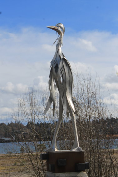 This steel sculpture of a heron looks toward the property on West Bay Drive that would be developed under a recent proposal.