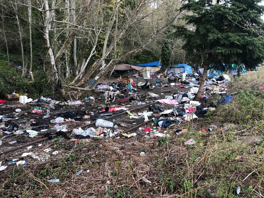 This shows a portion of the debris spread outside of the tents and other temporary shelters that are on private property along the west side of Deschutes Parkway across from Capitol Lake in Olympia. Image taken on April 5, 2021.