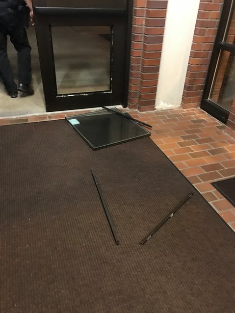 Michael Hansen admitted to police that he broke into the front door of Tumwater City Hall, as shown, according to their report.