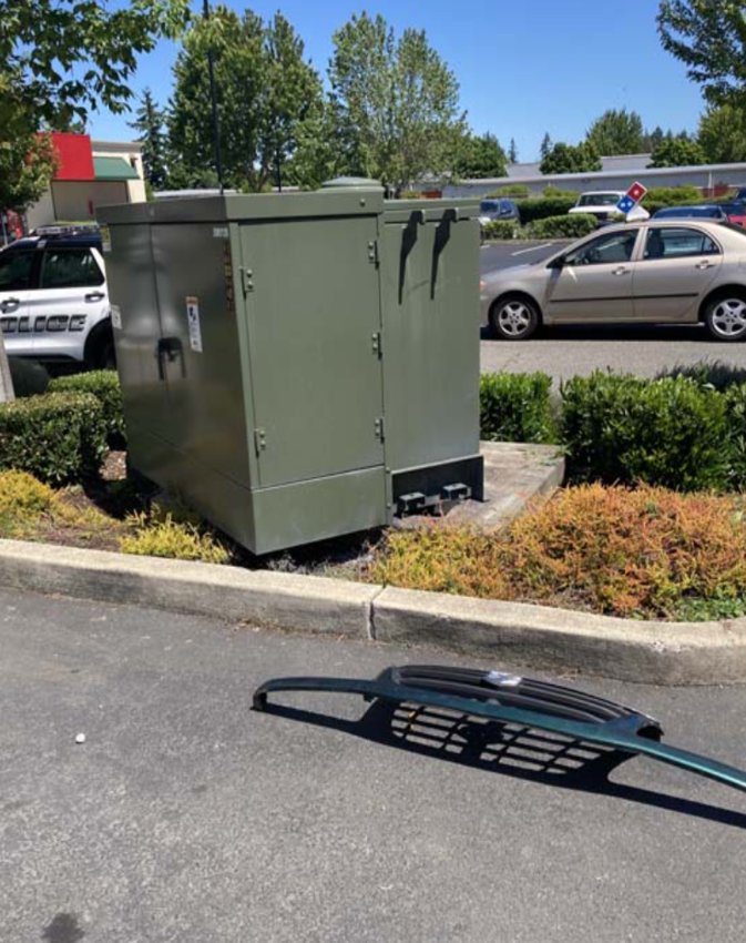 This is the Puget Sound Energy electrical transformer allegedly hit by Donavan J. McKinlay's Suzuki Sidekick after it travelled driverless across a fuel station parking lot. Note the vehicle grille on the ground, allegedly from the Sidekick.
