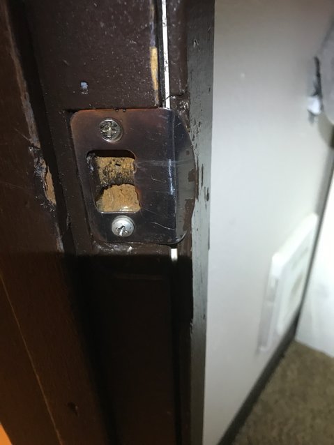 : Police said the door had been sunk in and was no longer aligned with the door jamb. The latch assembly was also found on the ground near the door.
