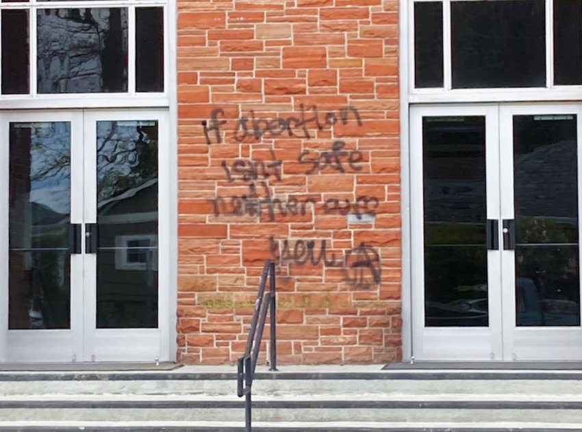 &quot;If abortion isn't safe neither are you&quot; and the anarchists' &quot;A&quot; symbol were painted onto this LDS Church in Olympia on Sunday, May 22.