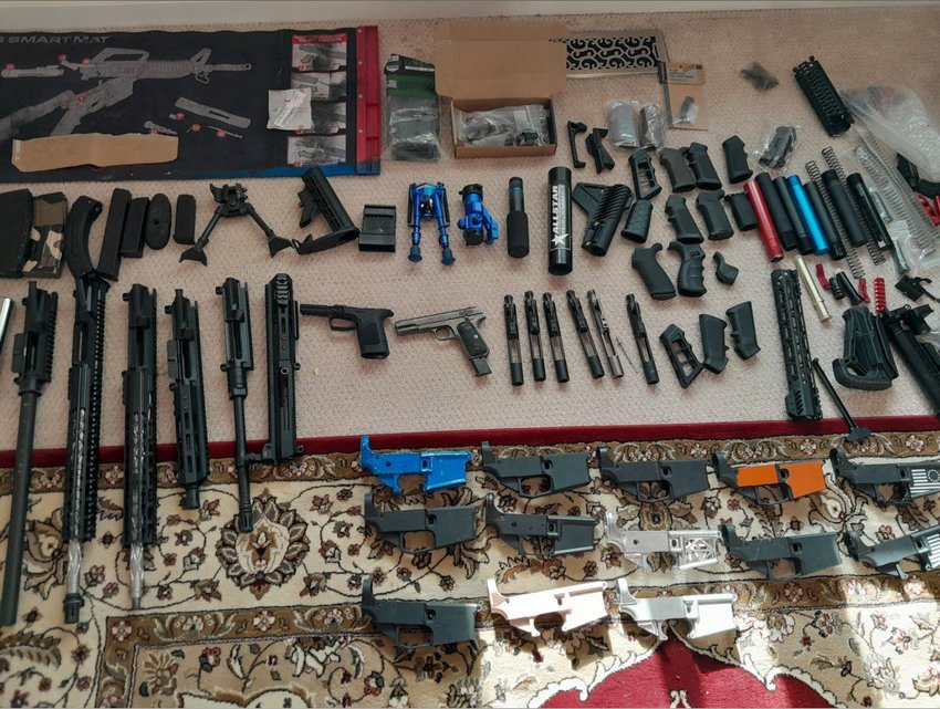Numerous firearms were seized at the suspect's property.