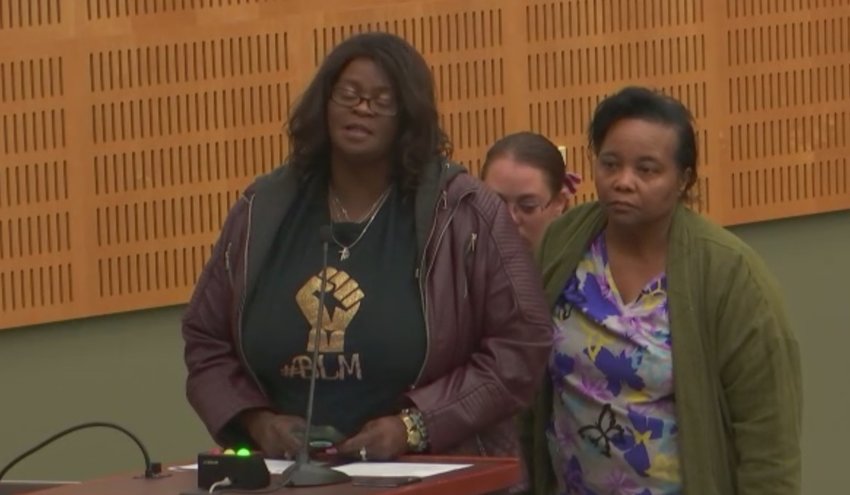 Mrs. Green, right, spoke at the Olympia City Council meeting yesterday, September 13, 2022, about her son Timothy, whom a police officer allegedly killed.