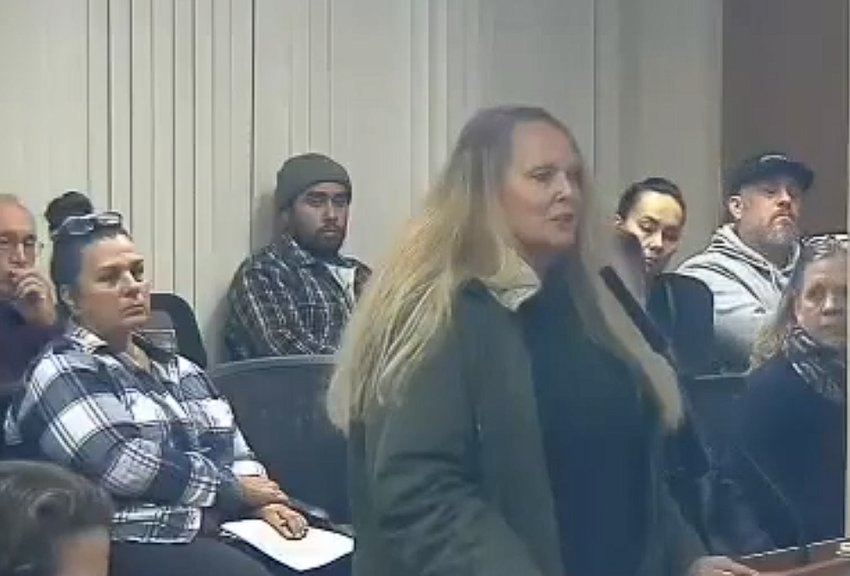Sunwood Lakes resident Robbi Currey (foreground) commented on the impact of the proposed airport on the groundwater supply during a Port of Olympia Commission meeting held on October 24, 2022.