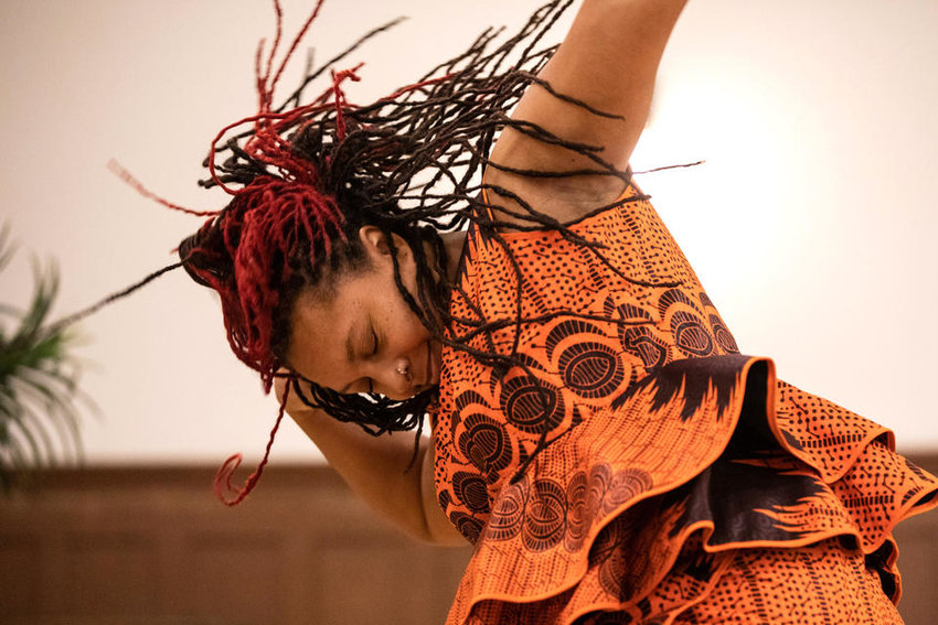 Nailah Bulley of ADEFUA Cultural Education Workshop, who teaches African drumming and dancing, performs at Northwest African American Museum&rsquo;s Kwanzaa celebration at Washington Hall on Thursday, Dec. 29, 2022. (Amanda Snyder/Crosscut)