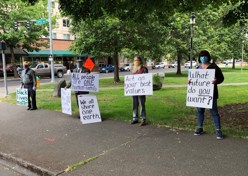 Glen Anderson protests at Sylvester Park on Wednesday, July 8, 2020, a few months into the pandemic. Shown l-r: Bob Ziegler, Glen Anderson, Richard Gaines and Step. Anderson has protested against nuclear weapons at Sylvester Park every Wednesday since March 5, 1980.