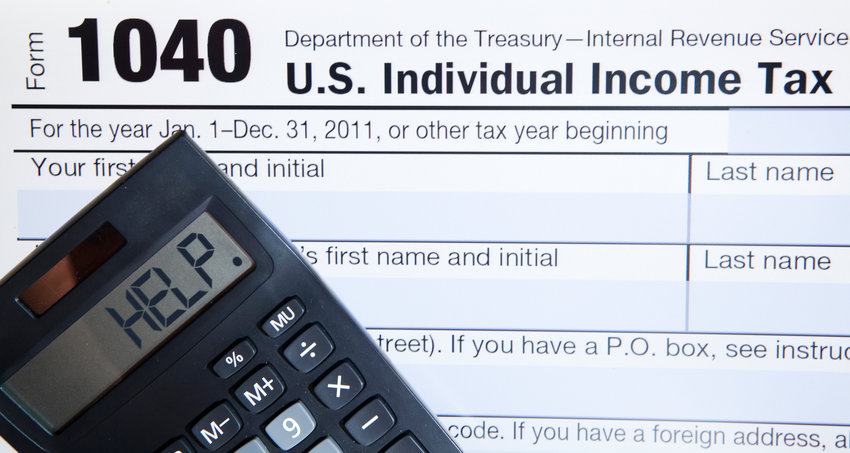 Electronic Tax form 1040 with the help word on calculator