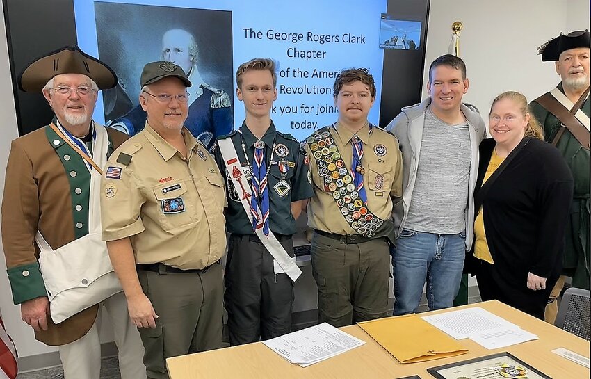 Connor Mitchell and Benjamin Womack won the 2022 Arthur &amp; Berdena King Scholarship Essay Competition. Left to Right: Lew Maudsley, GRC SAR President; Jordyn Mitchell; Connor Mitchell, 1st place Eagle Scout awardee, Puyallup; Cody Benjamin Womack, 2nd place Eagle Scout awardee, Puyallup; Carl Womack; Ashley Womack; and Dennis Case GRC SAR Eagle Recognition Chairman.