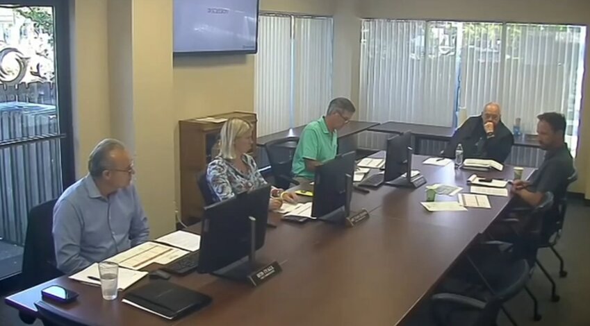 The Port of Olympia Commission discusses with HR Director Ben McDonald (first to the right) a possible salary raise for future commissioners.