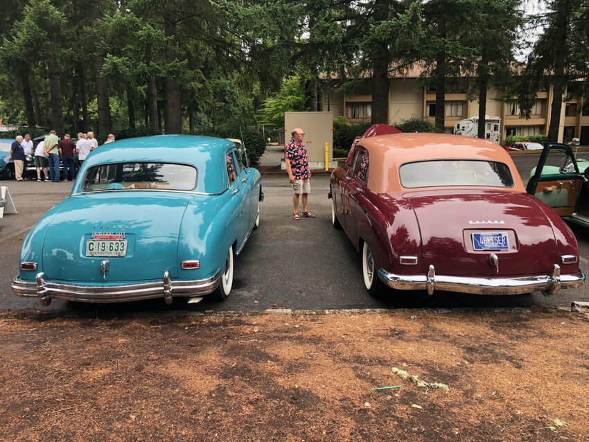 The 1947 Frazer on the left is nearly the twin of the 1948 Kaiser on the right; the models shared sheet metal and other parts.