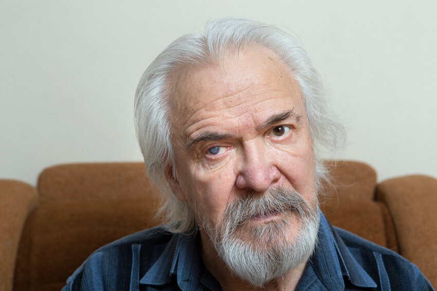An older man with a  cataract in one eye.