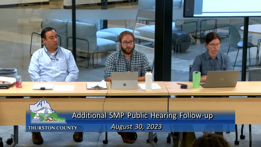 Senior Planner Andrew Deffobis (middle) provided the Board of County Commissioners with new information about state guidelines for shoreline buffers.