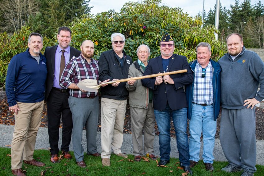 Michael Jameson is shown fourth from left with other leaders of the Lacey Gold Star Families Memorial Monument, at the memorial's groundbreaking event. From l-r: Andrew Barkis, Andy Ryder, Jessie Simmons, Michael Jameson, Jerry Wilkins, Michael Steadman, Ed Kunkel and Troy Kirby.