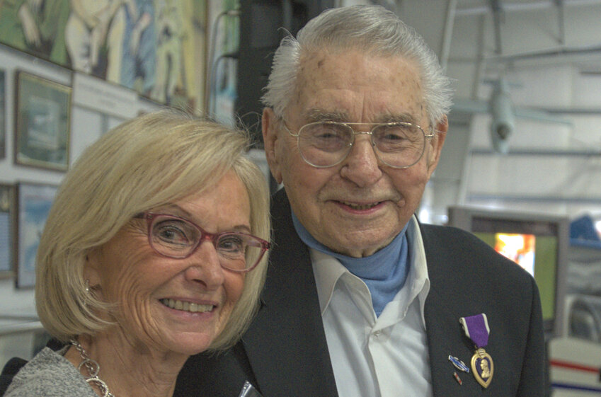 Harvey Drahos, right, with his friend Karen Schoessel, at the Olympic Flight Museum, after Drahos received his Purple Heart medal.