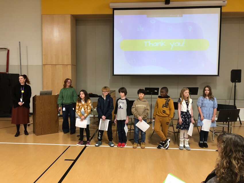 Pleasant Glade Elementary School&rsquo;s fourth and fifth grade Leadership Club students presented to the North Thurston School Board about their activities at the January 9, 2024 meeting. Shown at left is Principal Jessica Flanick, 5th Grade Teacher Nicki Goodwin and students (not in order) Sydney Goodrich, Simon Han, Miles McKinney, Crew Stephens, Xavier Robinson, Jordan Huffman and Evelyn Heron.