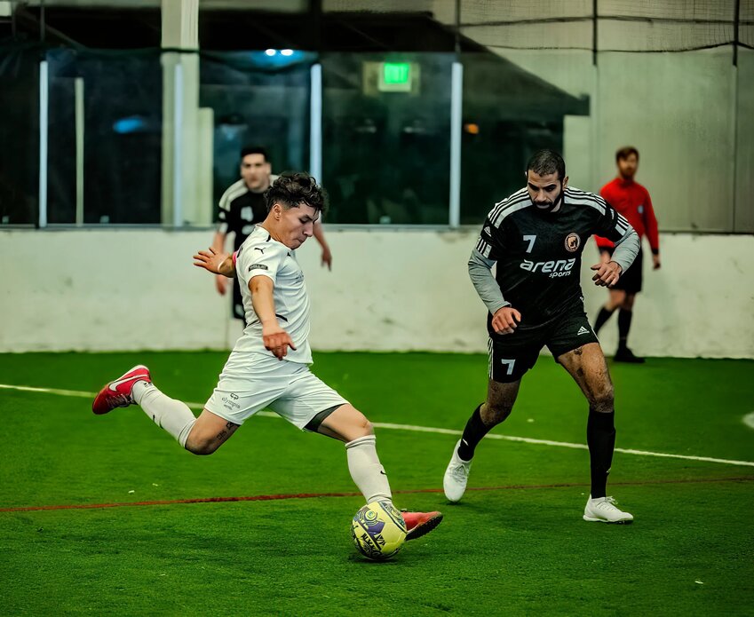 Manny Nicasio (in white) attempts a shot on goal vs Snohomish County FC