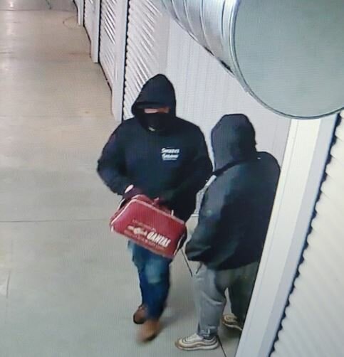 A screen capture of the two suspects caught on a security camera.