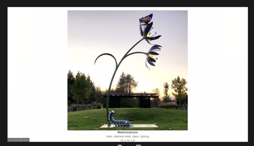 At the Olympia City Council meeting held Tuesday, January 23, 2024, Arts Commission Chair Kathy Dorgan presented an image of &quot;Metamorphosis,&quot; one of Abe Singer's art pieces. Singer was selected for the Grass Lake Nature Park public art project.