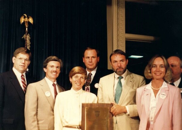 Olympia Mayor Bill Daley is shown in Washington, D.C., circa 1987, fifth from left holding the All-American City Award from the National League of Cities. Others shown, from left, include business owner Rob Panowicz, former city manager Dick Cushing, city councilmember Holly Gadbaw, Olympia Chamber of Commerce president Jim Krinbring, Olympia public information specialist Karen Goettling and city housing director Ken Black.