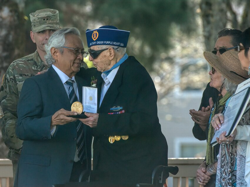 Harvey Drahos receives his Congressional Gold Medal from Enrico Tadeo of The Philippines&rsquo; Consulate during a ceremony held in DuPont&rsquo;s Clocktower Park on May 2, 2024.
