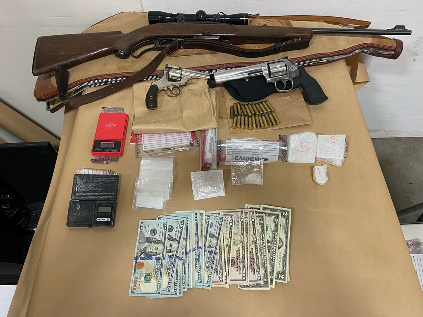 Guns and drugs were seized after executing a warrant on an alleged drug dealer's vehicle and storage unit by the Thurston County Narcotics Task Force  May 1, 2024.