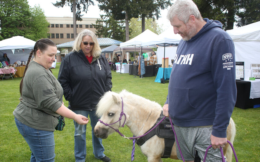 Annette Sloan, Chantel and Matt Wagner with their service pony Apollo