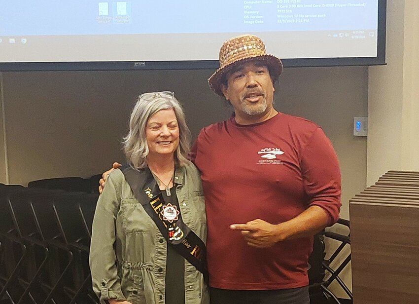Outgoing NTPS Superintendent Dr. Deb Clemens receives a pendant from Hanford McCloud of the Nisqually Indian Tribe at the school board's June meeting.