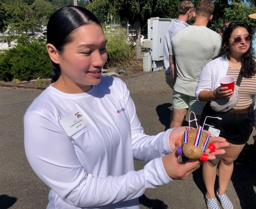 Airman First Class Colleenrae Baracinas shows off her championship potato car at the 2023 Foofaraw.